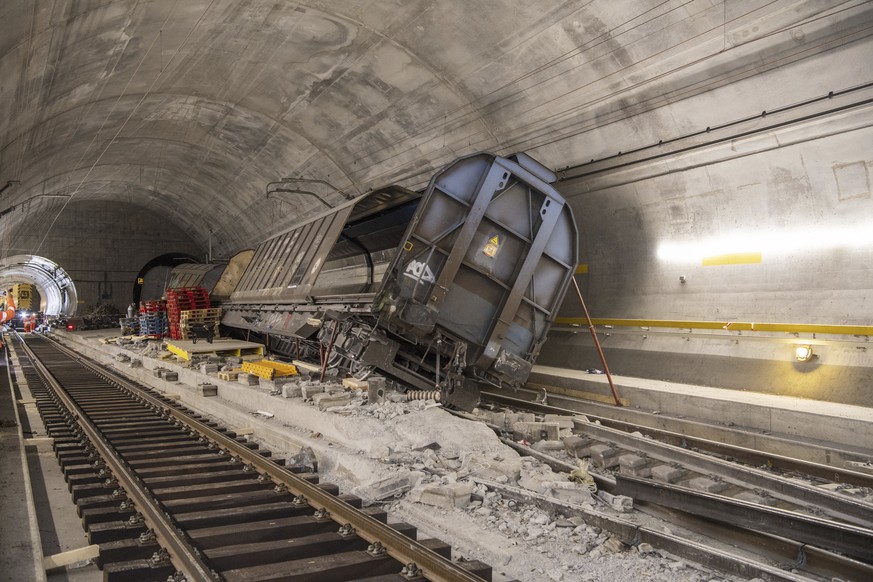 Accident-damaged freight wagons are seen at the scene of the accident in the Gotthard base tunnel near Faido during a media tour at the accident site on Wednesday, Sept. 6, 2023 in Faido in the canton ...