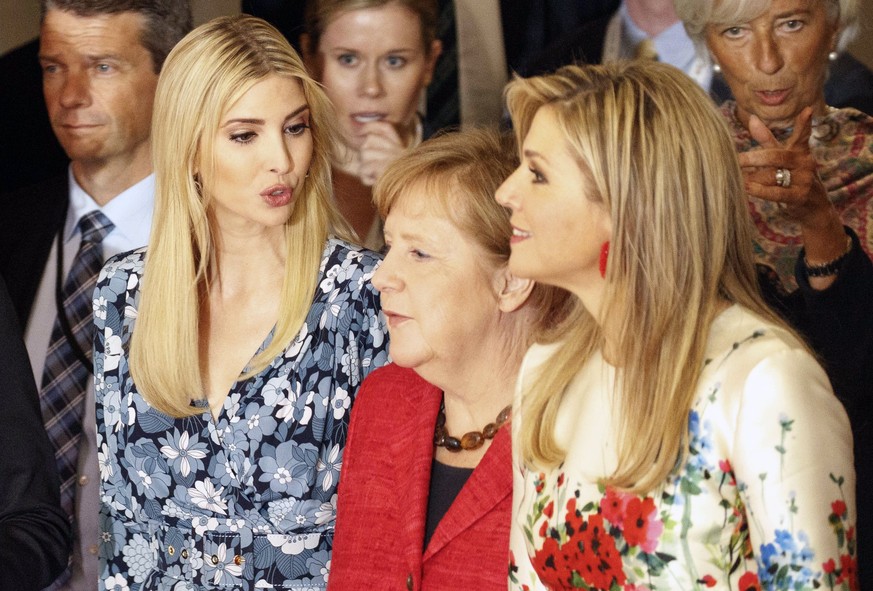 epa05926663 German Chancellor Angela Merkel (C), Queen Maxima of the Netherlands (R) and Ivanka Trump (L) arrive for a group picture before participating in the panel &#039;Inspiring women: Scaling Up ...