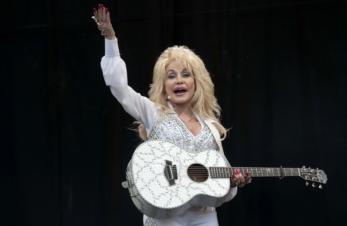 epa13191233 (FILE) - US singer Dolly Parton performs at the Pyramid Stage of the Glastonbury Festival of Contemporary Performing Arts 2014, held at Worthy Farm, near Pilton, Somerset, Britain, 29 June ...