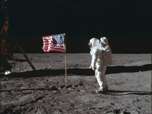 FILE - In this July 20, 1969, file photo made available by NASA, astronaut Buzz Aldrin Jr. poses for a photograph beside the U.S. flag on the moon during the Apollo 11 mission. Goodyear is teaming wit ...