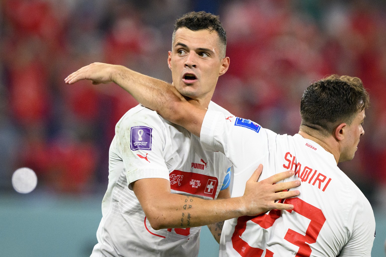 Swiss midfielder Xherdan Shaqiri, right, and Swiss midfielder Granit Xhaka, left, celebrate the third goal during the Qatar 2022 FIFA World Cup Group G soccer match between Serbia and…