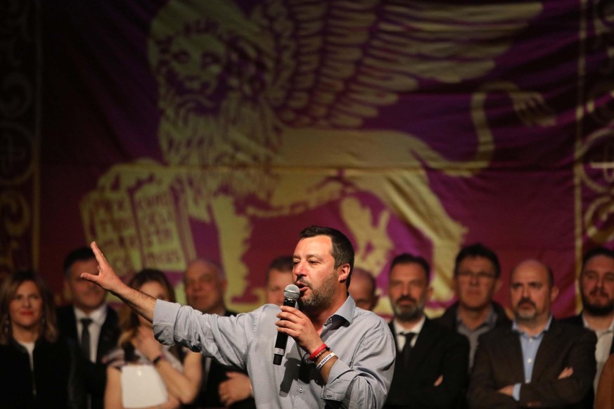 epa07461774 Italian Deputy Premier and Interior Minister, Matteo Salvini speaks on the podium during a Lega party election event in Treviso, Italy, 24 March 2019. Centre-right candidate Vito Bardi is  ...