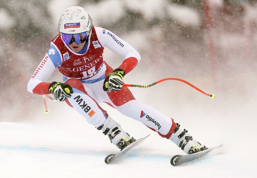 Corinne Suter, of Switzerland, skis down the course during the women&#039;s World Cup downhill ski race in Lake Louise, Alberta, Friday, Dec. 6, 2019. (Frank Gunn/The Canadian Press via AP)