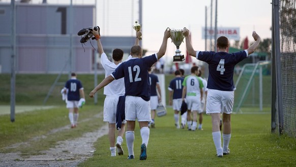 The amateur football players from the team UBS and winners of a regional soccer championship, are about to watch together the EURO 2008 European Soccer Championships match between Russia and Spain, in ...