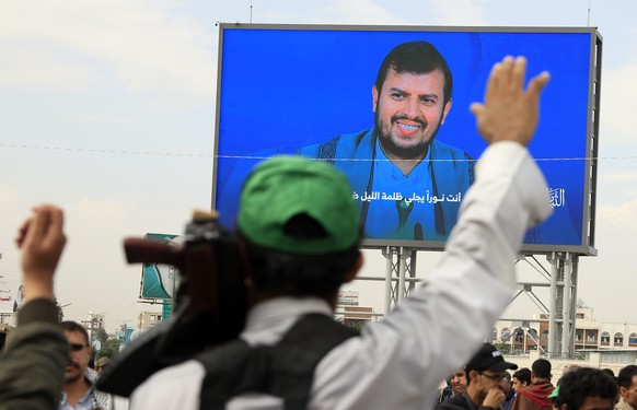 epa12334379 Houthi supporters gather in front of a digital billboard featuring Houthi leader Abdul-Malik al-Houthi, during a protest against Israel in Sana&#039;a, Yemen, 29 August 2025. Thousands of  ...