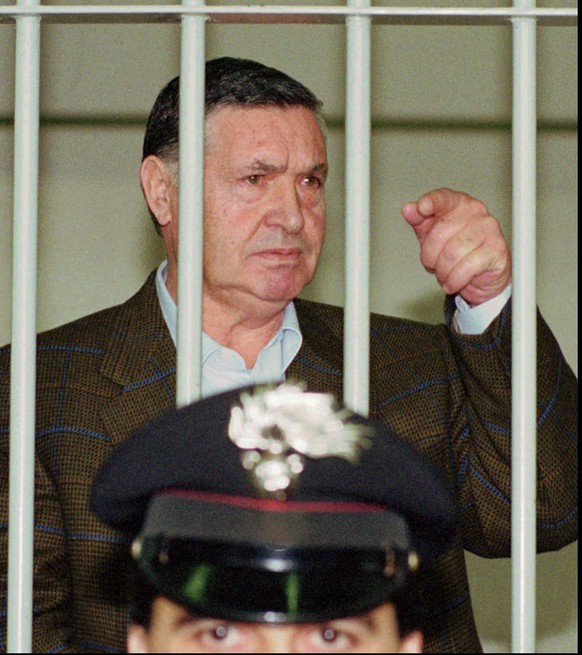 FILE - In this April 29, 1993 file photo, Mafia &quot;boss of bosses&quot; Salvatore &quot;Toto&quot; Riina, is seen behind bars, during a trial in Rome. Italy’s justice minister has given special per ...