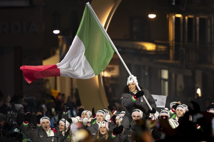 epa12710976 Flagbearer Federica Brignone and Team Italy enter the stadium during the Opening Ceremony of the Milano Cortina 2026 Winter Olympic Games in Cortina d'Ampezzo, Italy, 06 February 2026 ...