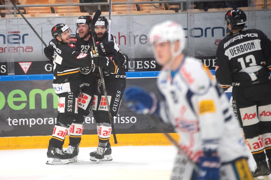 Lugano&#039;s player Mirco M�ller center celebrate the 3 - 0 goal with team mate, during the preliminary round game of National League A (NLA) Swiss Championship 2023/24 between, HC Lugano against EHC ...