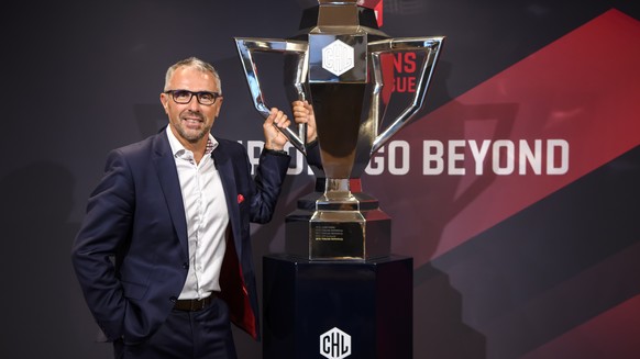 epa07780918 Champions Hockey League (CHL) CEO Martin Baumann poses next to the CHL Cup during a press conference about the current developments of the Champions Hockey League in Bern, Switzerland, 19  ...