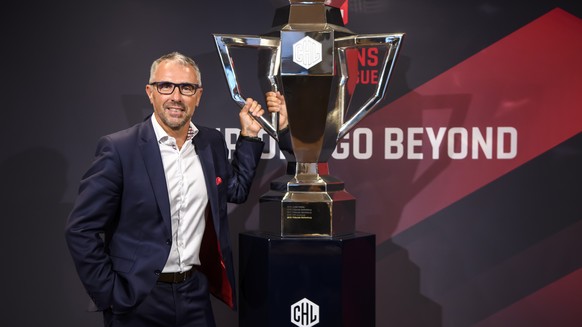 epa07780918 Champions Hockey League (CHL) CEO Martin Baumann poses next to the CHL Cup during a press conference about the current developments of the Champions Hockey League in Bern, Switzerland, 19  ...