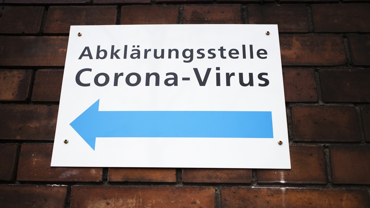 An information sign displayed at the wall of an hospital directing to a new set up test and information centre for the new coronavirus at the district Prenzlauer Berg in Berlin, Germany, Monday, March ...