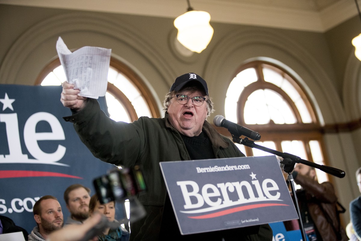 REMOVERS REFERENCE TO "FORMER SENATOR" Filmmaker Michael Moore holds up a list of what he says were cities where Democratic presidential candidate Sen. Bernie Sanders, I-Vt., campaigned for  ...
