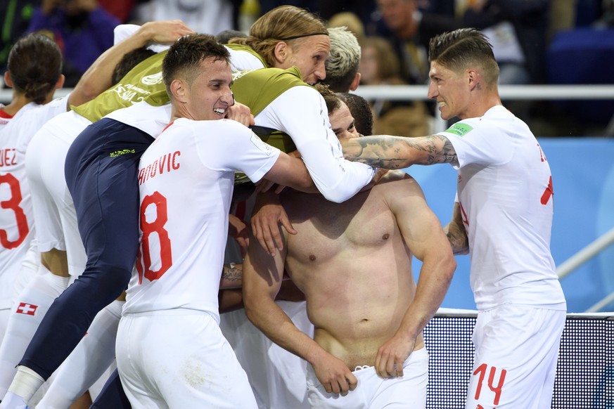 Switzerland&#039;s midfielder Xherdan Shaqiri, center, celebrates after scoring the winning goal with teamates Mario Gavranovic, left, Steven Zuber, right, and Michael Lang, center up, during the FIFA ...