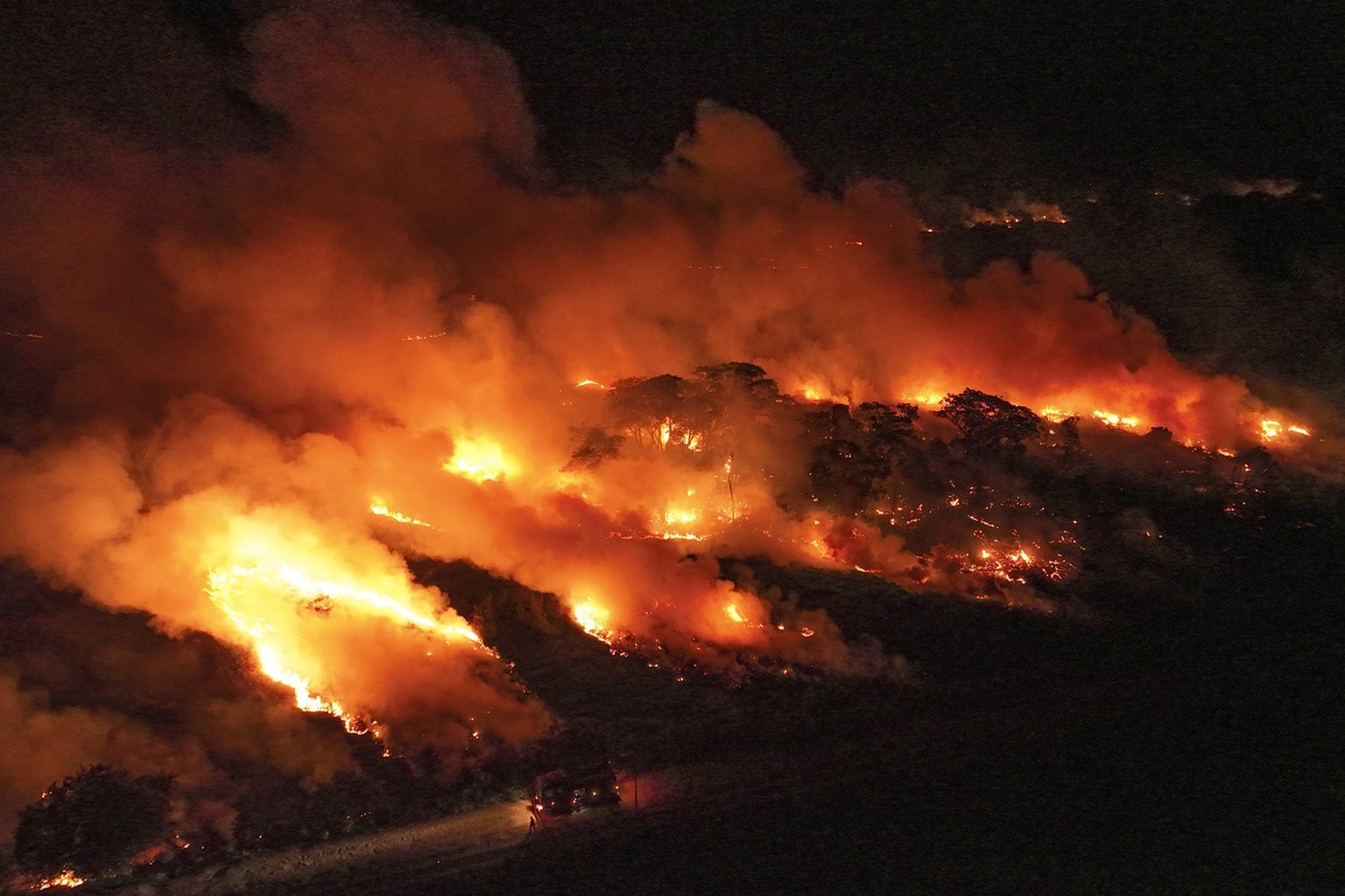 Fire consumes an area next to the Transpantaneira road in the Pantanal wetlands near Pocone, Mato Grosso state,Brazil, Wednesday, Nov. 15, 2023. Amid the high heat, wildfires are burning widely in the ...