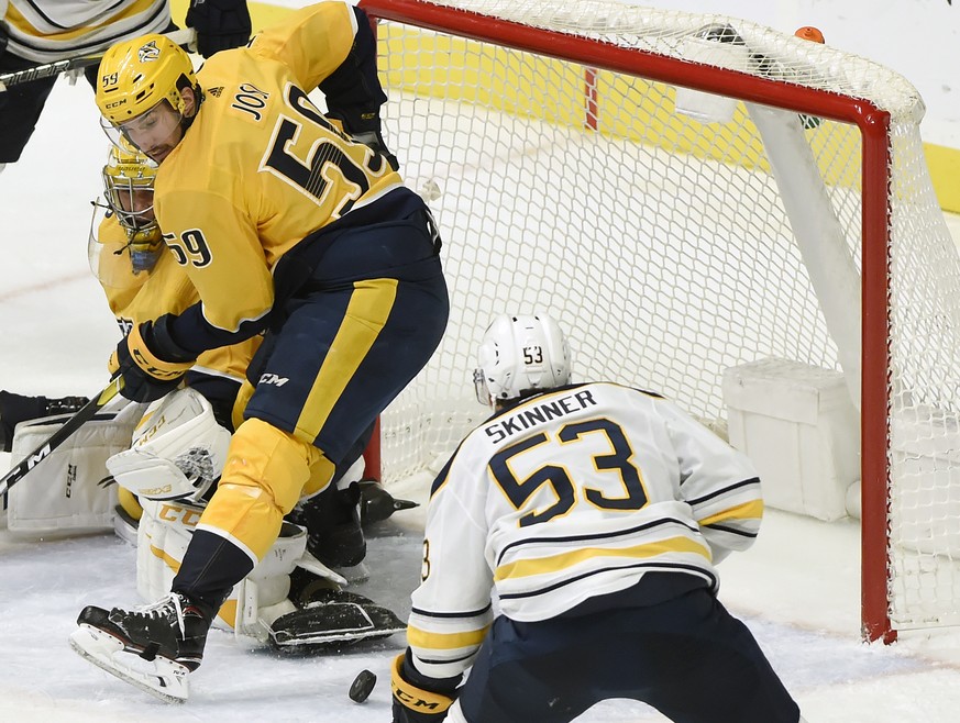 Buffalo Sabres left wing Jeff Skinner (53) moves in as he scores a goal against Nashville Predators defenseman Roman Josi (59), of Switzerland, and goaltender Pekka Rinne (35), of Finland, left, durin ...