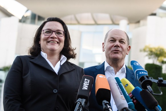 epa06862154 The leader of the Social Democratic Party (SPD) and Chairwoman of the SPD faction Andrea Nahles (L) and German Minister of Finance of the Social Democratic Party (SPD) Olaf Scholz (R), giv ...