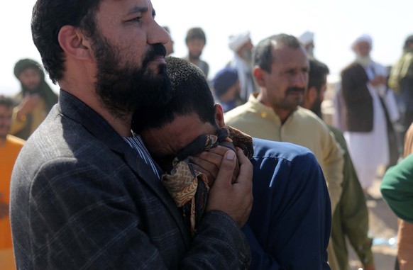 epa10912031 People who lost their loved ones in the earthquake react during their funeral in the earthquake-hit Zinda Jan district of Herat, Afghanistan, October 10, 2023. An earthquake with a magnitude of 6.3 and ...