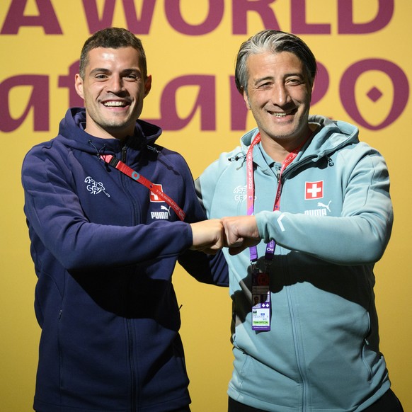 epa10322838 Switzerland&#039;s head coach Murat Yakin (R) and captain Granit Xhaka pose in the green carpet ahead of a press conference, on the eve of the FIFA World Cup Qatar 2022 soccer match agains ...