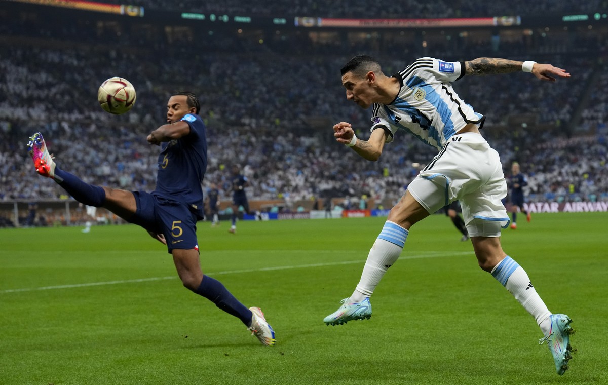 Argentina's Angel Di Maria connect a shot during the World Cup final soccer match between Argentina and France at the Lusail Stadium in Lusail, Qatar, Sunday, Dec. 18, 2022. (AP Photo/Natacha Pis ...