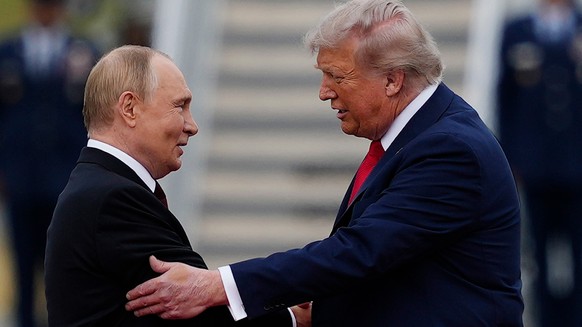 FILE - U.S. President Donald Trump greets Russian President Vladimir Putin, Aug. 15, 2025, at Joint Base Elmendorf-Richardson, Alaska. (AP Photo/Julia Demaree Nikhinson, File)
Vladimir Putin,Donald Tr ...