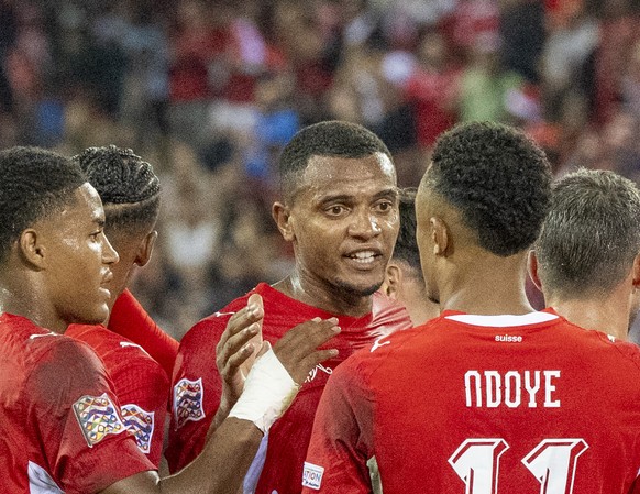 Players from Switzerland with Manuel Akanji, centre, reacts after the 1:0 goal at the UEFA Nations League B of Group 1 soccer match between Switzerland and North Macedonia at the Thermoplanarena in Lu ...