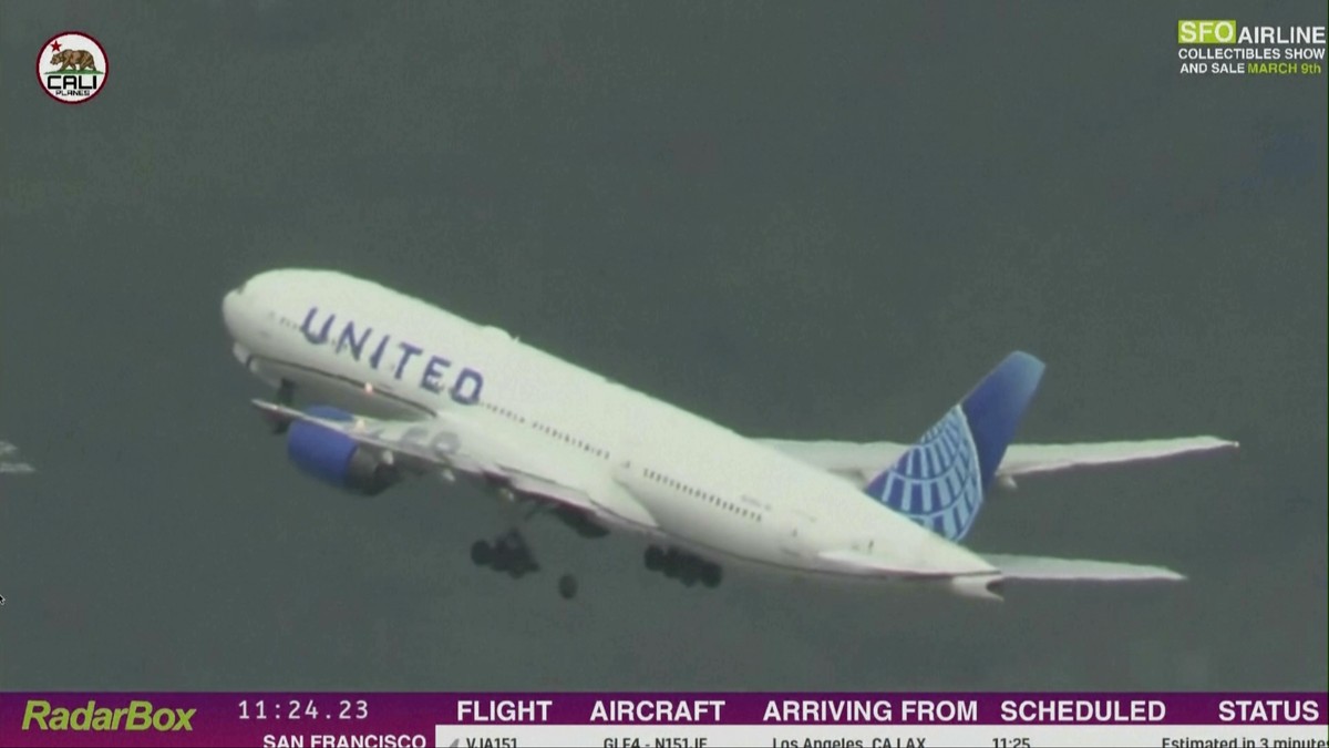 In this image taken from video provided by Cali Planes, a United Airlines Boeing 777 bound for Japan loses a tire as it takes off from San Francisco International Airport, Thursday, March 7, 2024. The ...