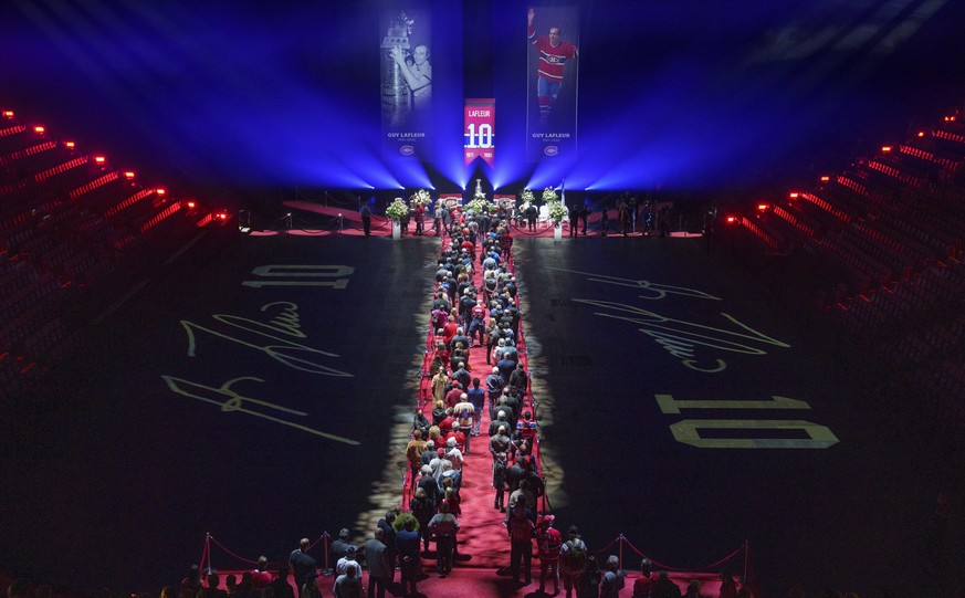 Fans line up to pay their respects to Guy Lafleur during visitation at the Bell Centre in Montreal on Monday, May 2, 2022. Funeral services for the former Montreal Canadiens player will be held Tuesda ...