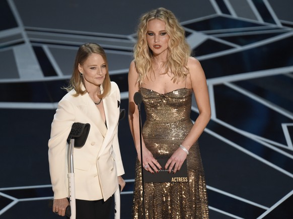 Jodie Foster, left, and Jennifer Lawrence present the award for best performance by an actress in a leading role at the Oscars on Sunday, March 4, 2018, at the Dolby Theatre in Los Angeles. (Photo by  ...