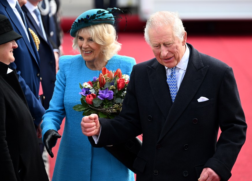 epa10548585 Britain&#039;s King Charles III and Camilla, The Queen Consortin, arrive at the airport in Berlin, Germany, 29 March 2023. King Charles is on his first state visit abroad as monarch to Ger ...