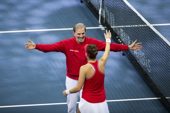 Switzerland&#039;s Belinda Bencic hugs team captain Heinz Guenthardt after winning her Billie Jean King Cup semi-final tennis match against Australia&#039;s Ajla Tomljanovic in Prague, Czech Republic, ...