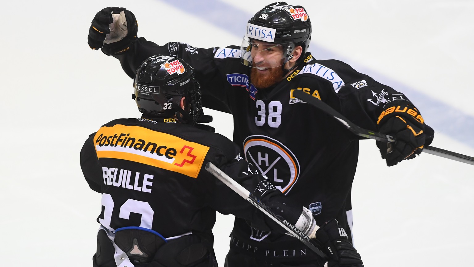 LuganoÕs player Sebastien Reuille and LuganoÕs player Raffaele Sannitz celebrate the 4-2 goal, during the fourth match the semifinal of National League Swiss Championship 2017/18 between HC Lugano and ...