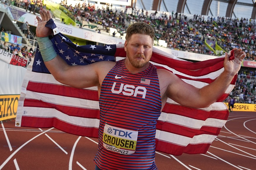 Gold medalist Ryan Crouser, of the United States, celebrates after the men&#039;s shot put final at the World Athletics Championships on Sunday, July 17, 2022, in Eugene, Ore. (AP Photo/Charlie Riedel ...