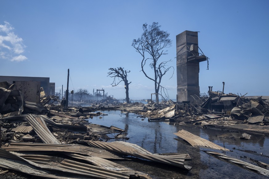 Wildfire wreckage is seen Wednesday, Aug. 9, 2023, in Lahaina, Hawaii. The scene at one of Maui's tourist hubs on Thursday looked like a wasteland, with homes and entire blocks reduced to ashes a ...