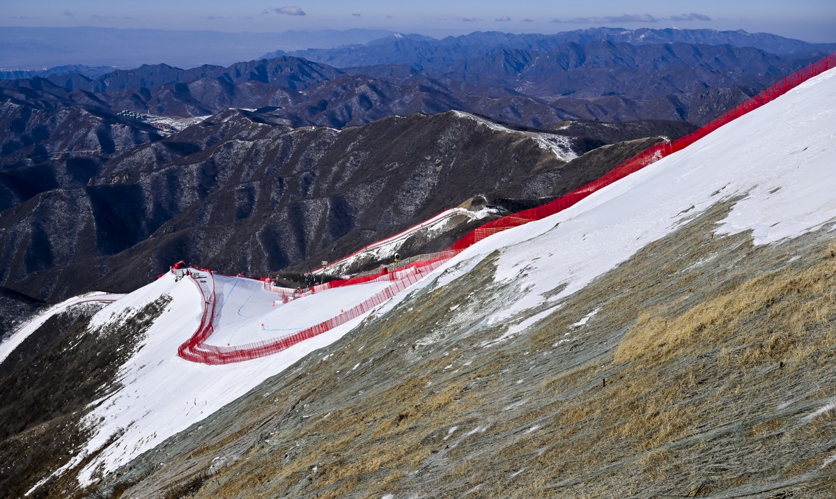 epa09726841 A general view of the ski slopes of the alpine skiing venue during the 2nd training run for the Men's Downhill race of the Alpine Skiing events of the Beijing 2022 Olympic Games at th ...