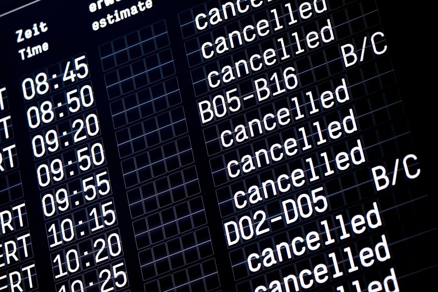 epa07272791 A screen board shows cancelled flights as members of the United Services Trade Union (ver.di) take part in a warning strike by ground security inspection staff at Cologne-Bonn airport in C ...
