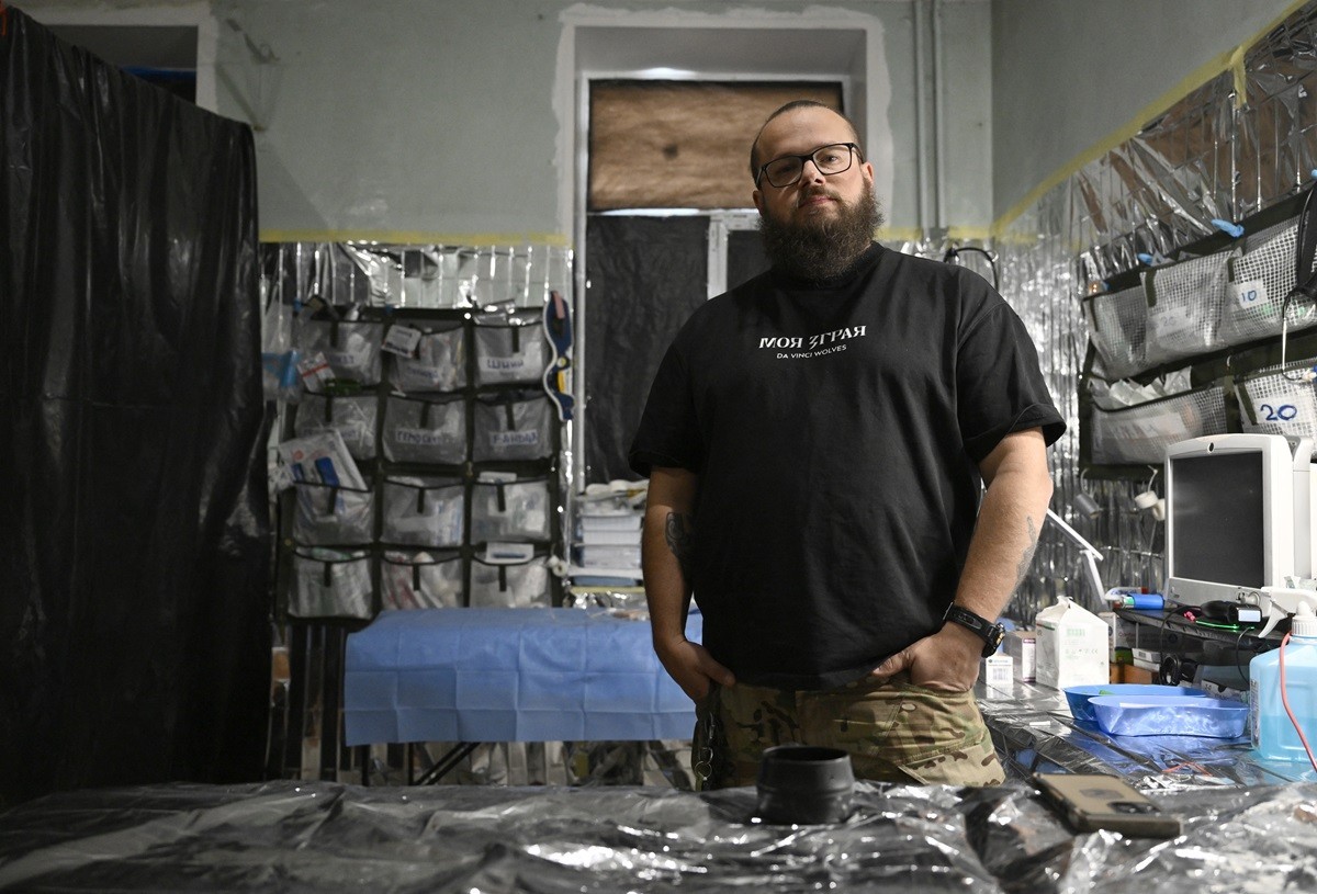Frontline medic Vladyslav Chumachenko, 39, poses for a photo during an AFP interview in an undisclosed location in the Donetsk region on February 20, 2025, amid the Russian invasion of Ukraine. The Ru ...