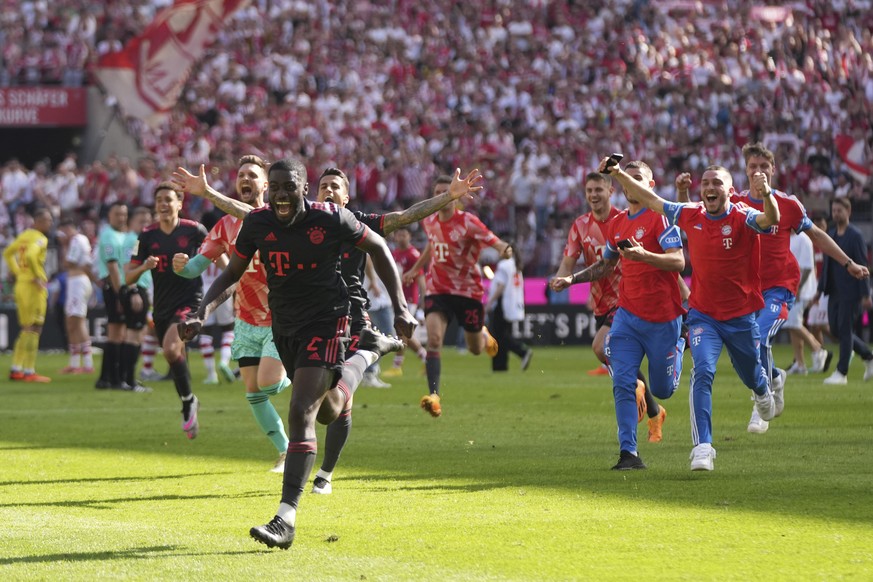 Bayern Munich players celebrate winning the German championship after the German Bundesliga soccer match between 1.FC Cologne and FC Bayern Munich in Cologne, Germany, Saturday, May 27, 2023. (AP Phot ...