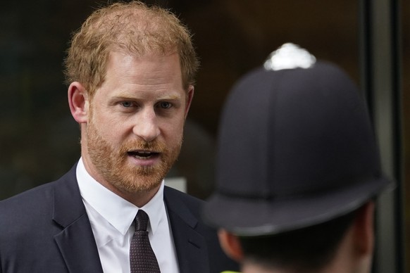 FILE - Prince Harry leaves the High Court after giving evidence in London, Tuesday, June 6, 2023. Prince Harry is challenging on Tuesday, Dec. 5, 2023, the British government?s decision to strip him o ...