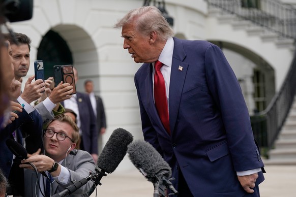 President Donald Trump speaks to reporters as he walks to board Marine One on the South Lawn of the White House, Friday, May 8, 2026, in Washington. (AP Photo/Jose Luis Magana)
Donald Trump