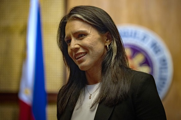 epa12150599 United States Director of National Intelligence Tulsi Gabbard (R) looks on during her meeting with the Philippine president at Malacanang Palace in Manila, Philippines, 02 June 2025. Gabba ...