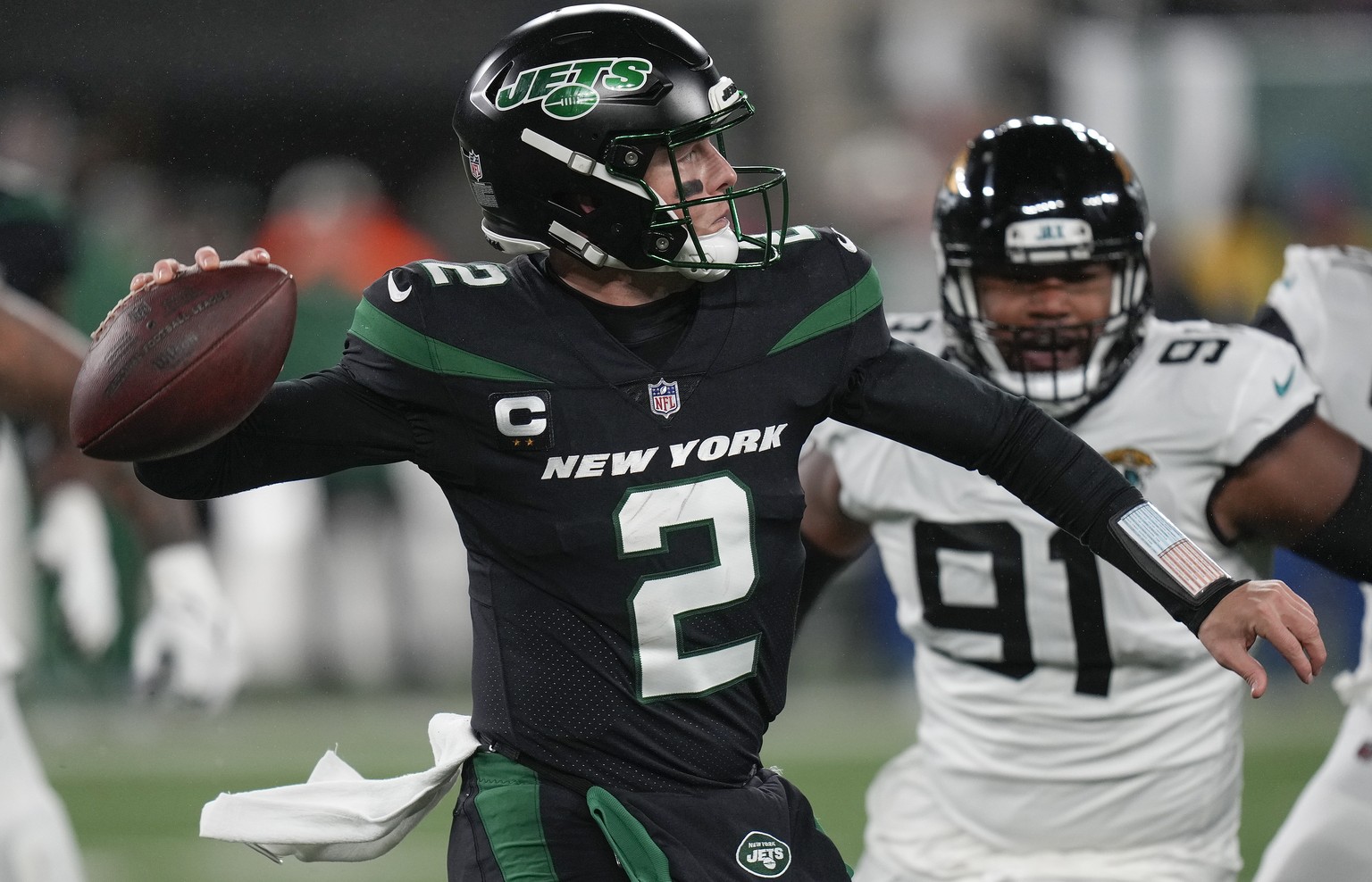 New York Jets quarterback Zach Wilson (2) passes against the Jacksonville Jaguars during the first quarter of an NFL football game, Thursday, Dec. 22, 2022, in East Rutherford, N.J. (AP Photo/Seth Wen ...