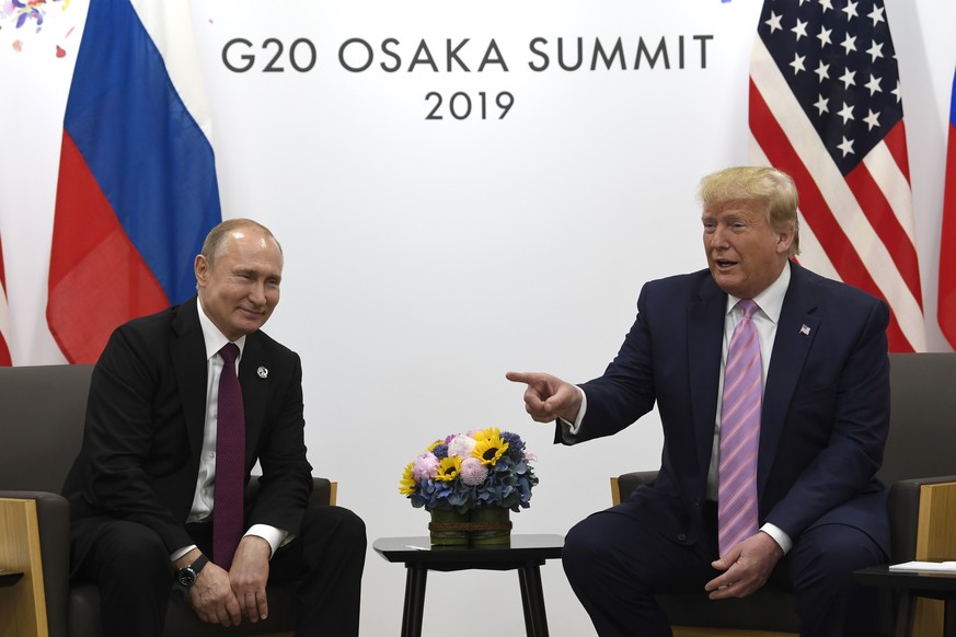 President Donald Trump, right, meets with Russian President Vladimir Putin during a bilateral meeting on the sidelines of the G-20 summit in Osaka, Japan, Friday, June 28, 2019. (AP Photo/Susan Walsh) ...
