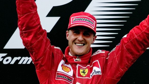 Germany&#039;s Michael Schumacher holds aloft the trophy for winning the Malaysian Grand Prix on Sunday October 22, 2000. Schumacher&#039;s victory ensured his Ferrari team their tenth Constructors&#0 ...