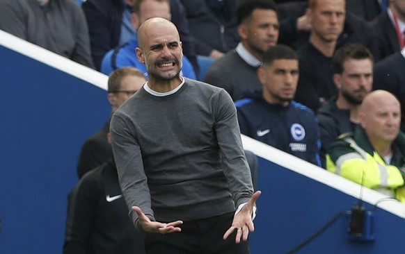 Manchester City coach Pep Guardiola gestures during the English Premier League soccer match between Brighton and Manchester City at the AMEX Stadium in Brighton, England, Sunday, May 12, 2019. (AP Pho ...