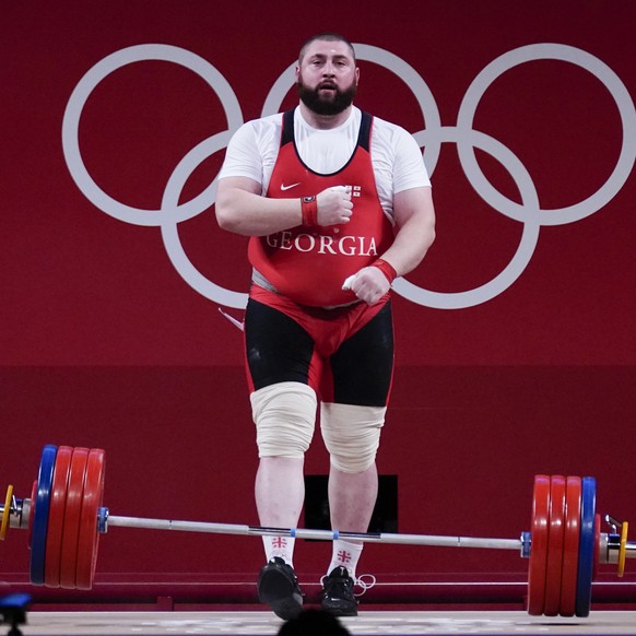 Lasha Talakhadze of Georgia celebrates after a lift as he competes in the men&#039;s +109kg weightlifting event, at the 2020 Summer Olympics, Wednesday, Aug. 4, 2021, in Tokyo, Japan. (AP Photo/Seth W ...