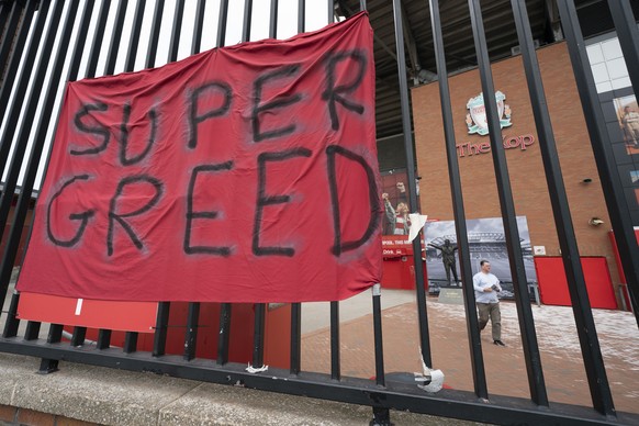 FILE - In this file photo dated Wednesday, April 21, 2021, a protest banner against the proposed Super League is seen outside Liverpool&#039;s Anfield Stadium after the collapse of English involvement ...