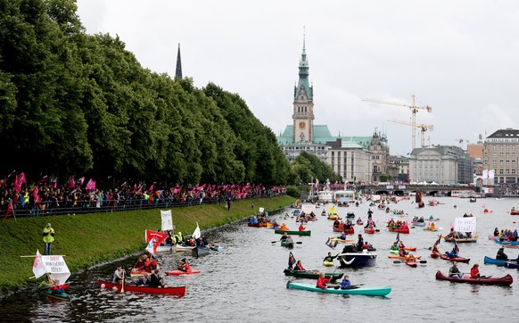 epa06061442 People in kayaks and small boats take part in a protest against the G20 summit in Hamburg, northern Germany, 02 July 2017. The G20 Summit (or G-20 or Group of Twenty) is an international f ...