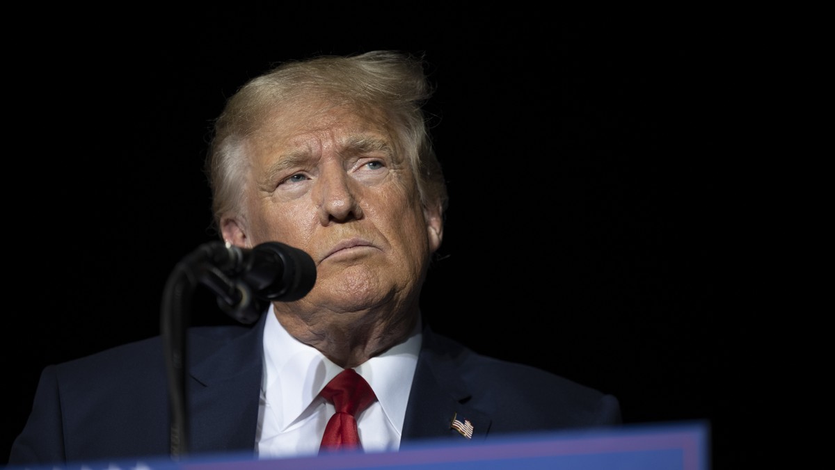 FILE - Former President Donald Trump pauses while speaking at a rally at the Minden Tahoe Airport in Minden, Nev., on Oct. 8, 2022. It
