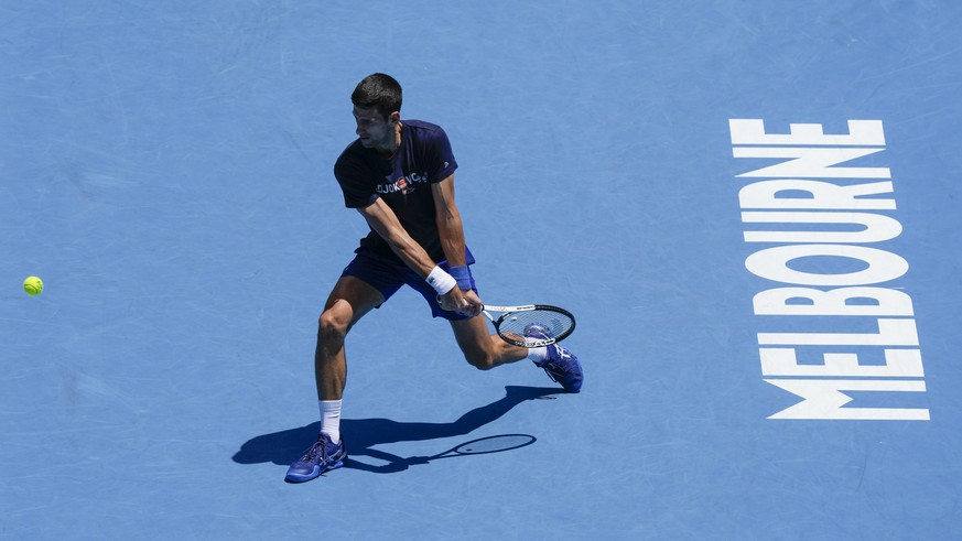 Defending men&#039;s champion Serbia&#039;s Novak Djokovic practices on Rod Laver Arena ahead of the Australian Open tennis championship in Melbourne, Australia, Wednesday, Jan. 12, 2022. AP Photo/Mar ...