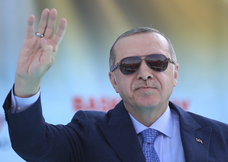 Turkey&#039;s President Recep Tayyip Erdogan waves to supporters as he attends an opening ceremony for a rail commute line in Ankara, Turkey, Thursday, April 12, 2018. Erdogan says he will discuss way ...